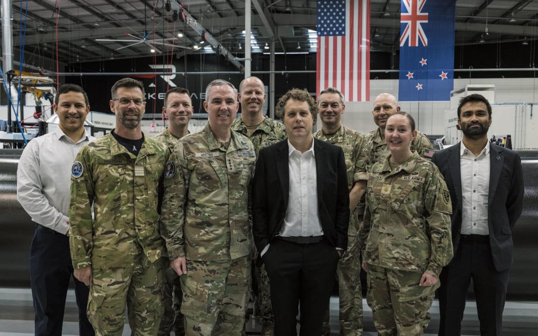 Commander US Space Command General Stephen Whiting (C-L) and Rocket Lab founder Sir Peter Beck (C-R) in July.