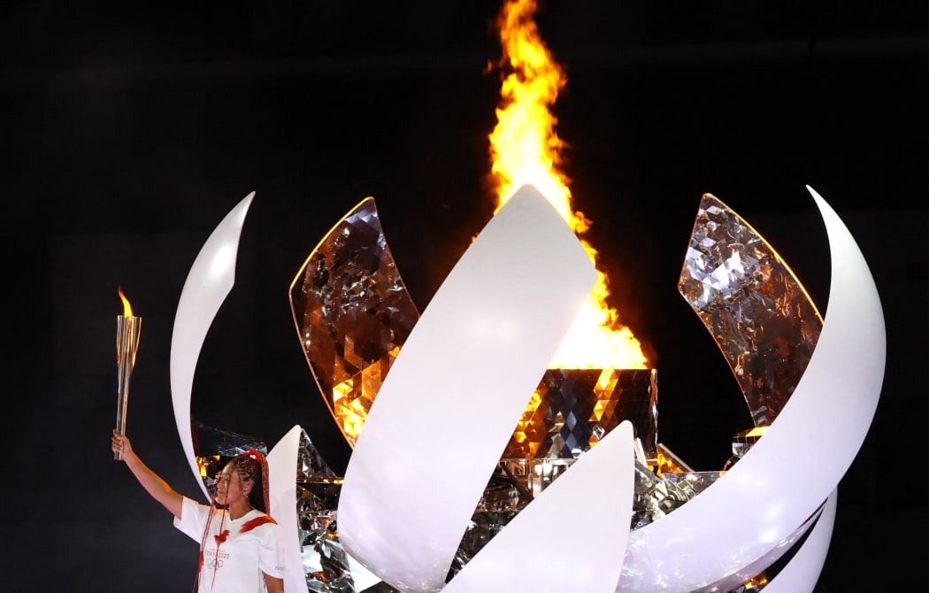 Naomi Osaka, Japanese tennis player, ignites the torch during the Opening Ceremony of the Tokyo 2020 Olympic Games at National Stadium in Tokyo on July 23rd, 2021.