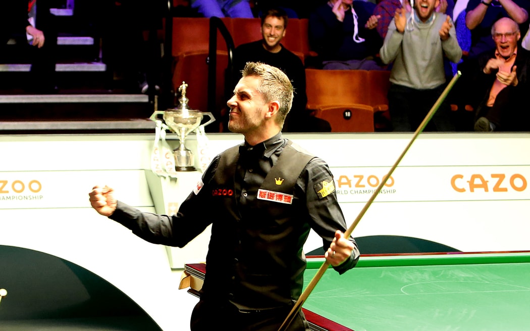 Mark Selby celebrates making a maximum 147 break in the final against Luca Brecel.