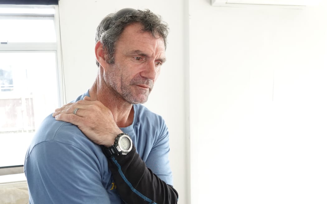 Roy Mattock surveys the damage at his Palmerston North house.