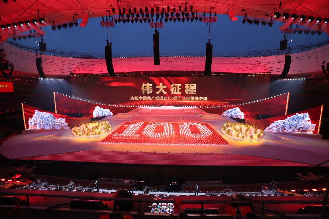 People perform on the stage during the Great Conquest to celebrate the 100-year of the Chinese Communist Part at National Stadium, known as Birds' Nest in Beijing on June 29, 2021. The Communist Party of China, founded in Shanghai on July 1st has more than 90 million memebers.