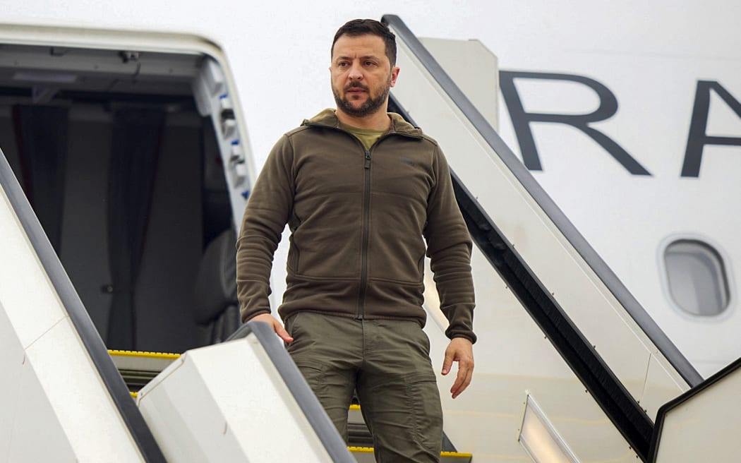 This handout photograph taken and released by the Ukrainian Presidential Press Service on May 20, 2023, shows Ukraine's President Volodymyr Zelensky disembarking upon his arrival at Hiroshima Airport at Mihara, Hiroshima prefecture, on the second day of the G7 Summit Leaders' Meeting. Zelensky's surprise summit appearance -- he had been expected to appear by video call -- is his furthest foray from Kyiv since Russia's invasion began 15 months ago. (Photo by Handout / Ukrainian Presidential Press Service / AFP) / -----EDITORS NOTE --- RESTRICTED TO EDITORIAL USE - MANDATORY CREDIT "AFP PHOTO / HANDOUT / UKRAINIAN PRESIDENTIAL PRESS SERVICE" - NO MARKETING - NO ADVERTISING CAMPAIGNS - DISTRIBUTED AS A SERVICE TO CLIENTS  - NO ARCHIVES