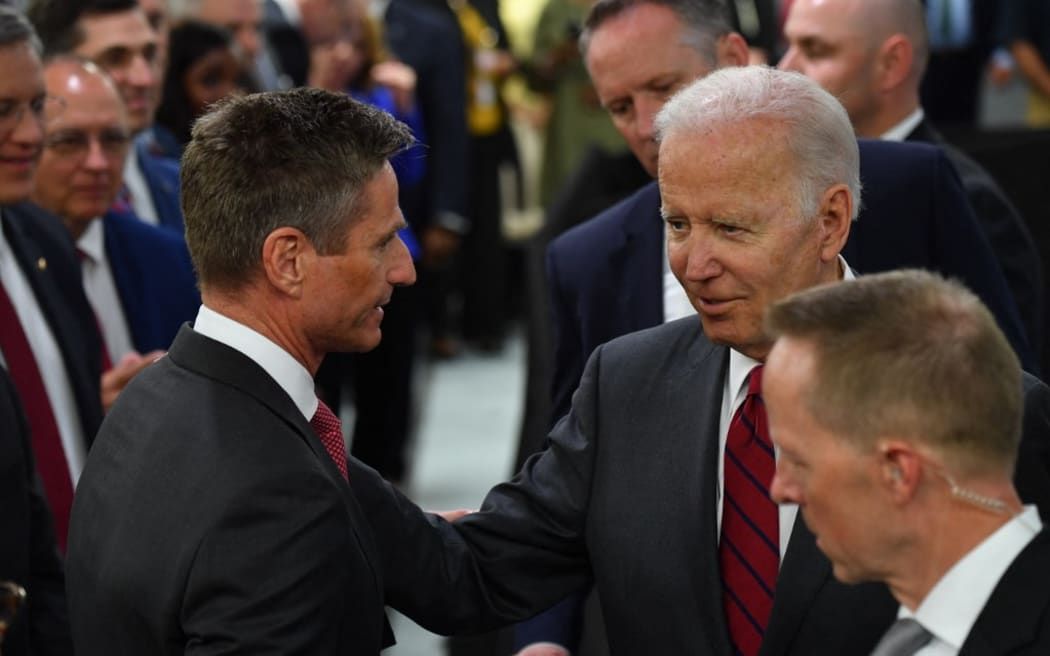 Joe Biden speaks with Lockheed Martin CEO Jim Taiclet after touring a weapons factory in Alabama.