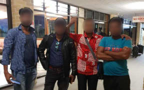 Four of the ten refugees bound for resettlement in the USA and Norway at the airport in Nauru. September 2020