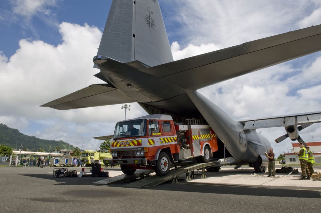 The fire truck is unloaded at Chuuk Airport.