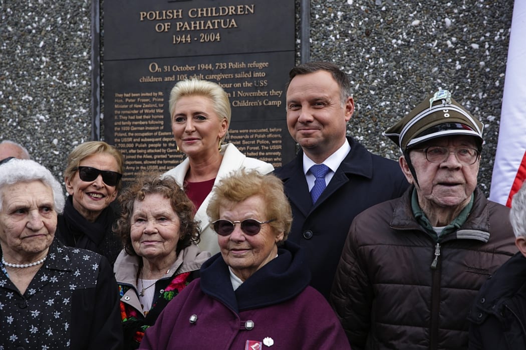 Andrjez Duda with his wife, Agata Kornhauser-Duda (at back) with members of the Polish Community in Wellington.