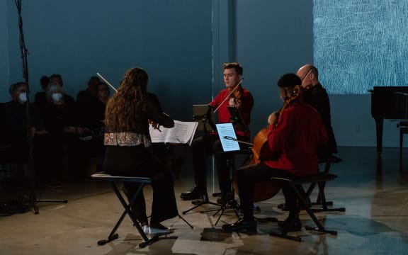 Musicians of the 2024 At The World's Edge Festival on stage.