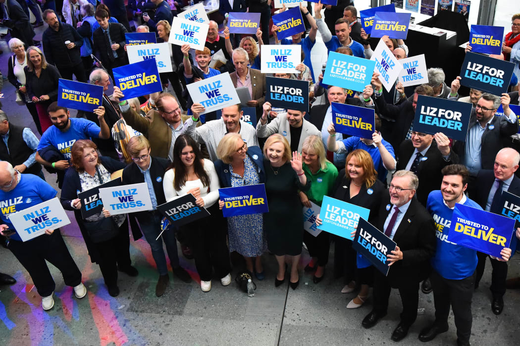 Contender to become the country's next Prime minister and leader of the Conservative party British Foreign Secretary Liz Truss is greeted by supporters as she arrives to attend a Conservative Party Hustings event in Perth, on August 16, 2022. (Photo by ANDY BUCHANAN / AFP)