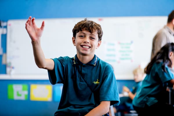 Sterling Thompson, 10, is a student in Phillip King's class at Oranga School, in Auckland. He is seen in this picture doing the sign for rugby.