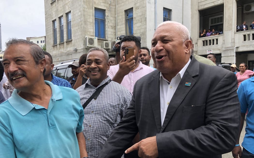 Bainimarama in a more jovial mood after being granted an absolute discharge without a conviction.