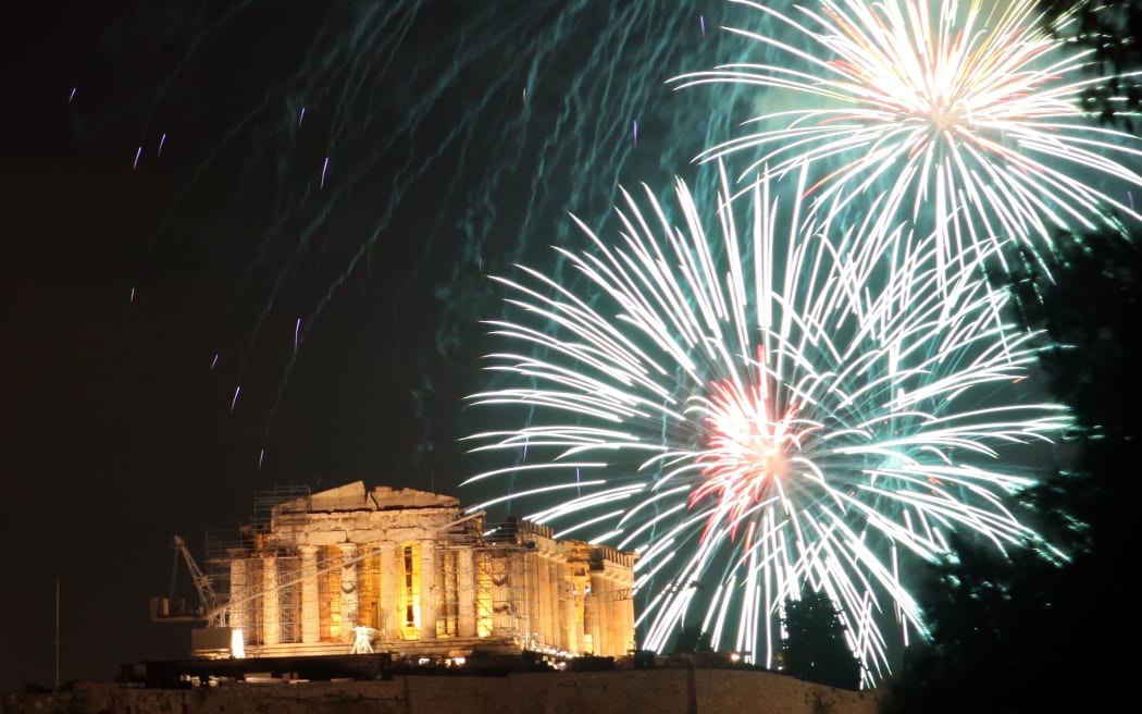 Fireworks light up over the ancient Parthenon temple at the Acropolis Hill in Athens.