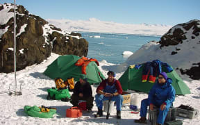 Niwa technician Steve Wilcox (centre) camped in the Antarctic after installing tidal stations at Possession Island, one of the first landing places in Antarctica.