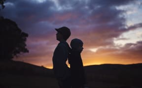 brothers at sunset