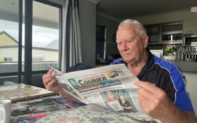 John Warburton reads the latest edition on the Courier. His Grandfather started up the Waipa post in 1911. 