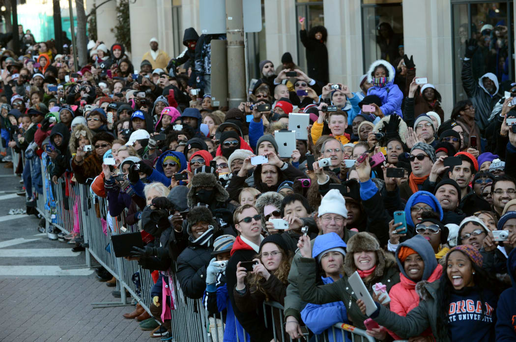 First Lady Michelle Obama's motorcade travels along Pennsylvania Avenue during the parade following his second inauguration as the 44th US president on 21 January 2013.