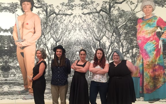 The panellists under Cindy Sherman's mural