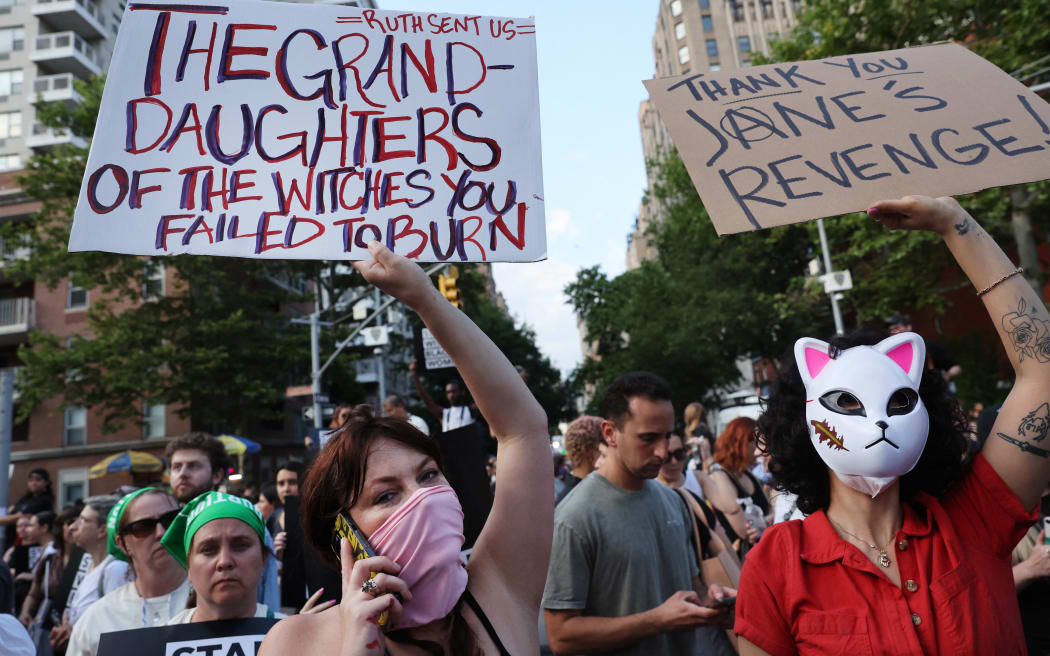 NEW YORK CITY - JUNE 24: People gather at Washington Square Park to protest against the the Supreme Court's decision in the Dobbs v Jackson Women's Health case on June 24, 2022 in the Manhattan borough of New York City. The Court's decision in the Dobbs v Jackson Women's Health case overturns the landmark 50-year-old Roe v Wade case, removing a federal right to an abortion.   Spencer Platt/Getty Images/AFP (Photo by SPENCER PLATT / GETTY IMAGES NORTH AMERICA / Getty Images via AFP)