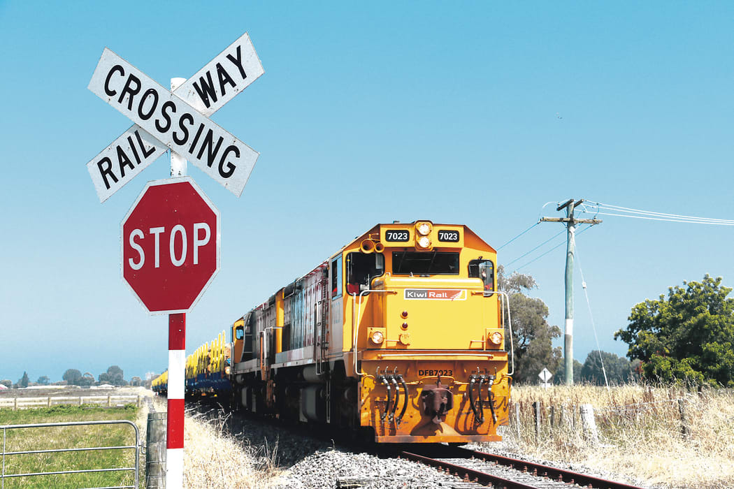 BACK ON TRACK: The first working log train leaves Wairoa with logs for Napier Port on Sunday