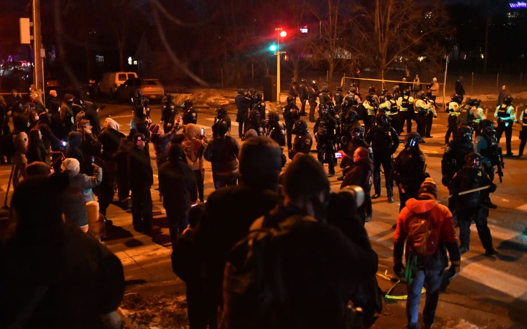 Federal law enforcement agents and police officers in riot gear face off with protesters following the shooting of a Venezuelan man by a Immigration and Customs Enforcement (ICE) agent in Minneapolis, Minnesota, on January 14, 2026. A federal immigration agent shot a man January 14 in Minneapolis, city officials said, urging the public to "remain calm" a week after agents shot and killed an American woman in the same city.
Minneapolis Police Chief Brian O'Hara said the shooting resulted from a struggle in front of a residence between a man and an Immigration and Customs Enforcement (ICE) agent on the north side of the city. (Photo by Octavio JONES / AFP)