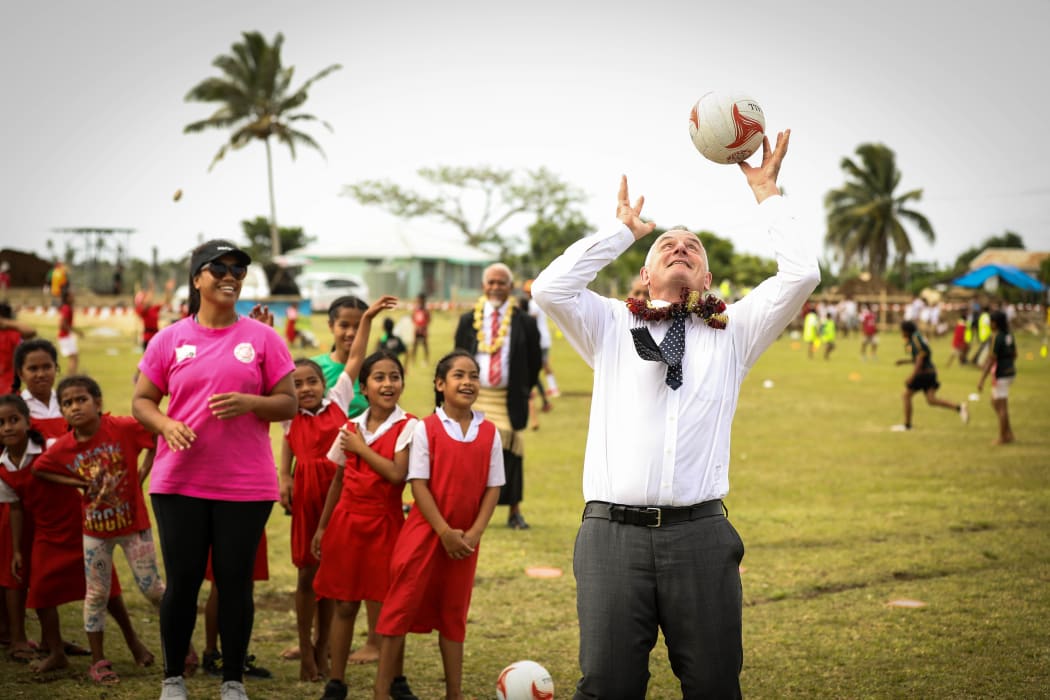 Speaker Trevor Mallard's netball skills are tested by students at Vaini Government Primary School