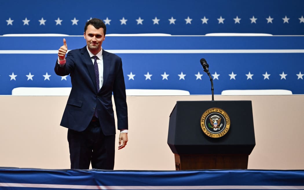 US media personality Charlie Kirk gives a thumbs up as he arrives to speak during the presidential inaugural parade inside Capitol One Arena, in Washington, DC, on January 20, 2025. (Photo by ANGELA WEISS / AFP)