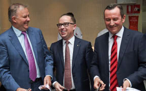 File photo of Qantas chief executive Alan Joyce (C), Western Australian Premier Mark McGowan (R) and Anthony Albanese opening a new transit lounge at Perth Airport on March 24, 2018.