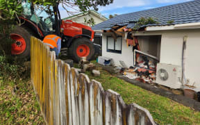 A tractor crashed into a house on Glenfield Road, North Shore, Auckland on 12 April 2023.