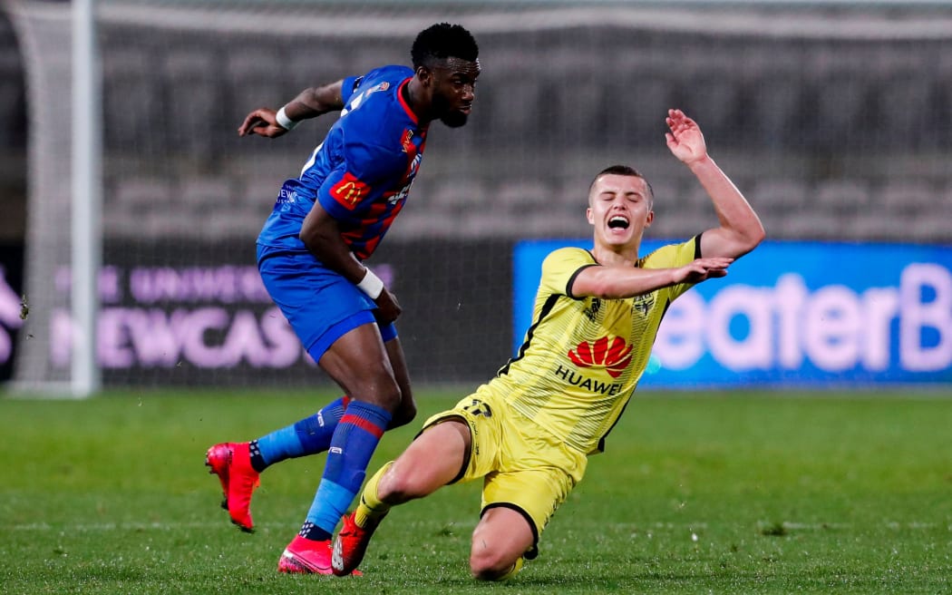 Callan Elliot of the Phoenix is tackled by Bernie Ibini of the Jets during the A-League match,  Wellington Phoenix v Newcastle Jets at Netstrata Jubilee Stadium , Thursday 13th August 2020 Copyright Photo: David Neilson / www.photosport.nz