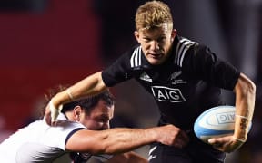 Damian McKenzie evades a tackle at Soldier Field, 2016.