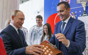 Russia's President Vladimir Putin and International Boxing Assosiation (AIBA) President Umar Kremlev.