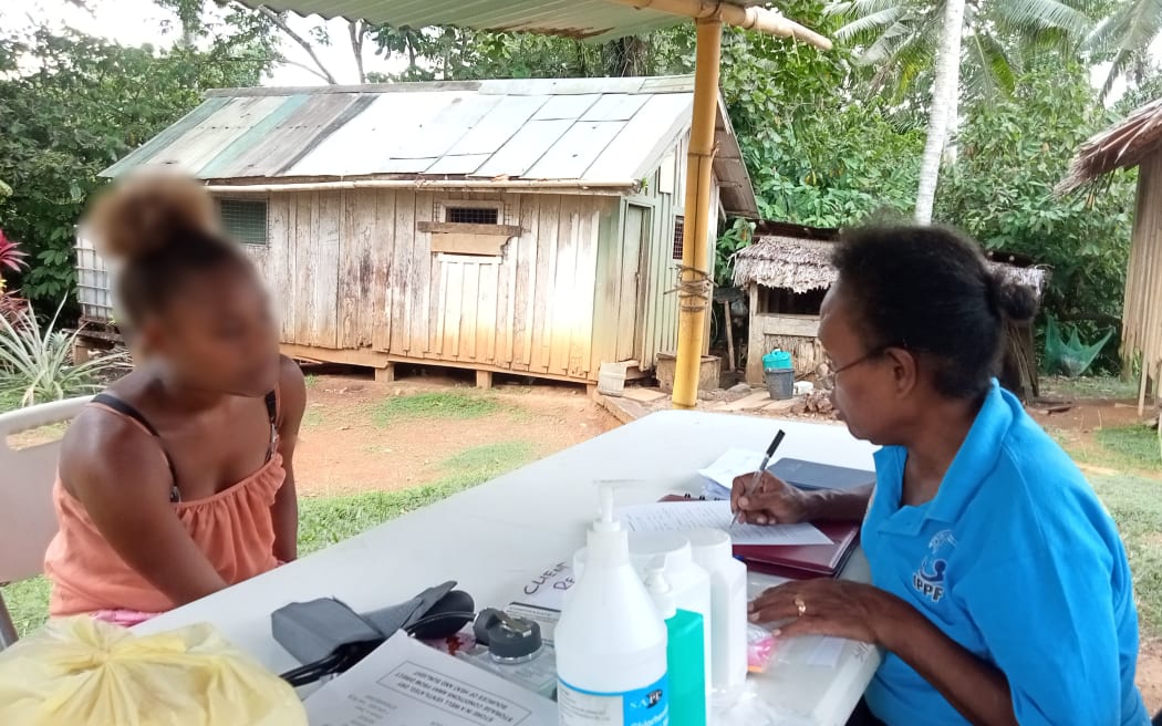 A clinical nurse provides advice to a young woman in Malaita province