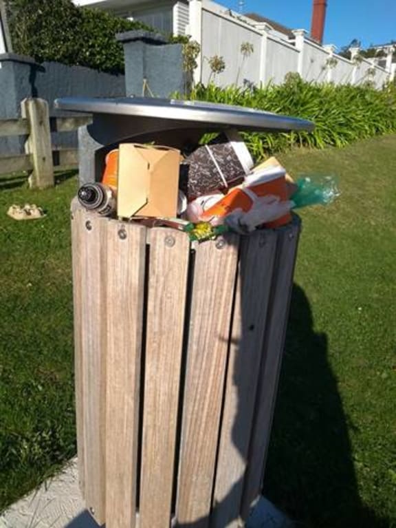 A Karori bin struggles to contain all the takeaway food waste. SUPPLIED