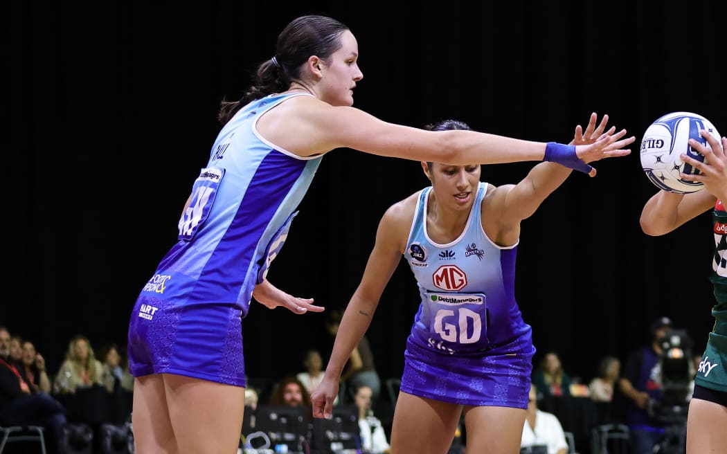Catherine Hall of the Mystics and Saviour Tui of the Magic during the ANZ Premiership round one match between the Magic and Mystics at Globox Arena in Hamilton, New Zealand on Saturday April 13, 2024. Copyright photo: Aaron Gillions / www.photosport.nz