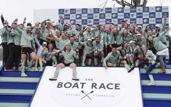 Crew members of Cambridge University celebrate winning the boat race in 2019.