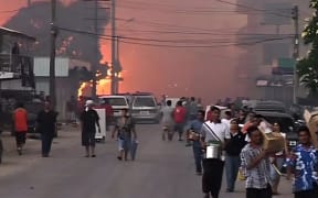 The destruction from the 2006 riots, pictured, led Tonga to secure a major Chinese loan to fund reconstruction of the capital. Additional loans were later used for road upgrades and the International Dateline Hotel.

Photo/John Ewen via Wikimedia Commons (CC BY-SA 2.5)