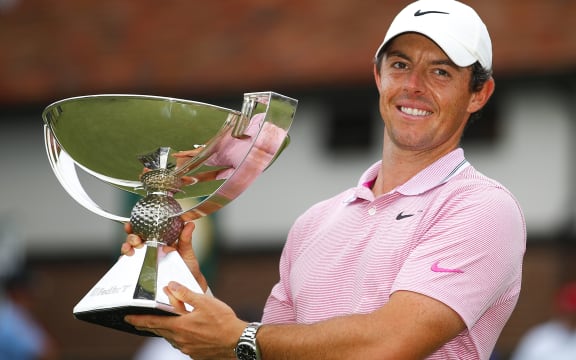 Rory McIlroy of Northern Ireland celebrates his victory as he holds the trophy at the conclusion of the final round of the Tour Championship at East Lake Golf Club in Atlanta.