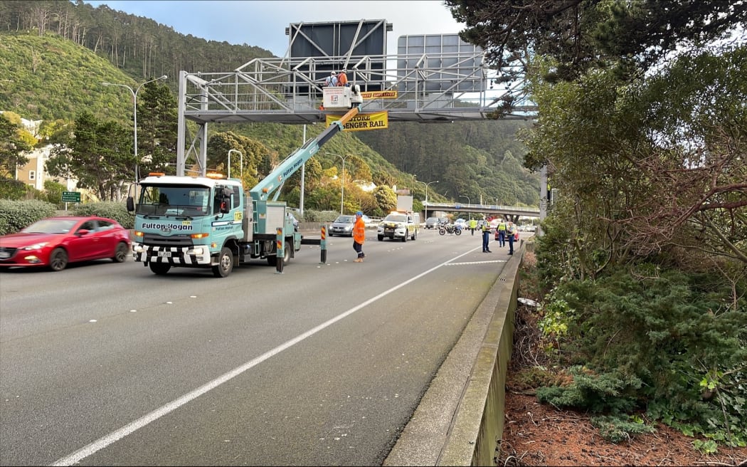 Protesters unfurled a banner across SH1 near Bowen St in Wellington on 31 August 2023.