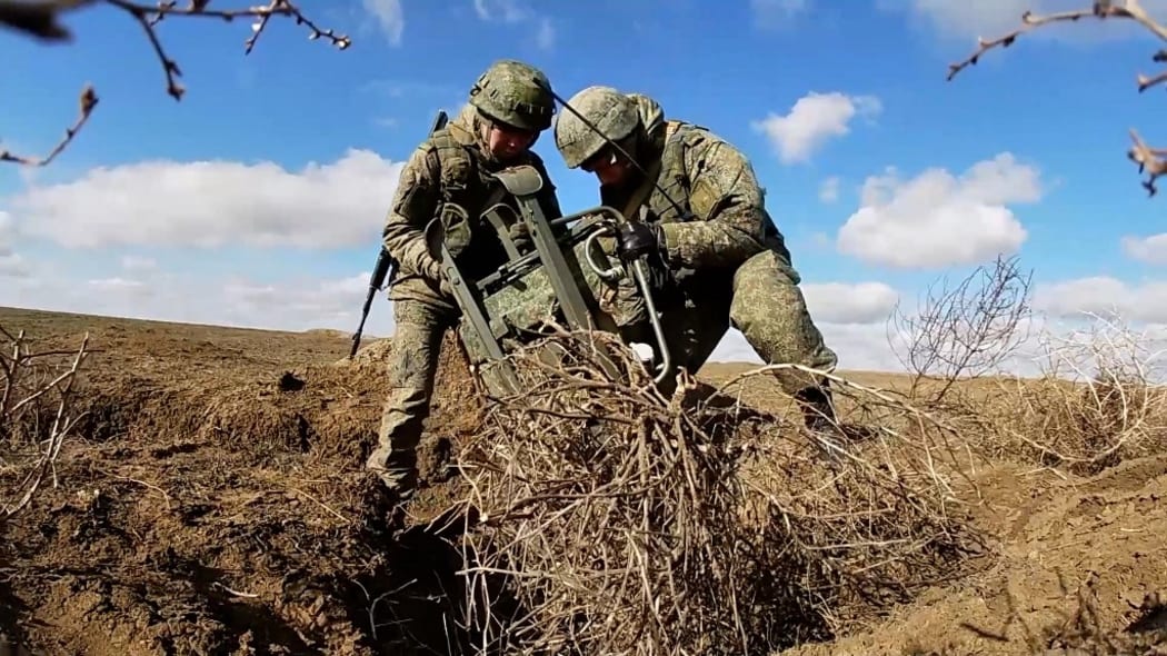 Russian armed forces artillery units conduct combat exercises in the Opuk training area in annexed Crimea in this footage released by the Russian defense ministry on Monday Feb 14, 2022.