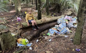 Sam Gibson and his three-year-old son Rehua (pictured) discovered the rubbish in Makauri Bush when they went to pick mushrooms.