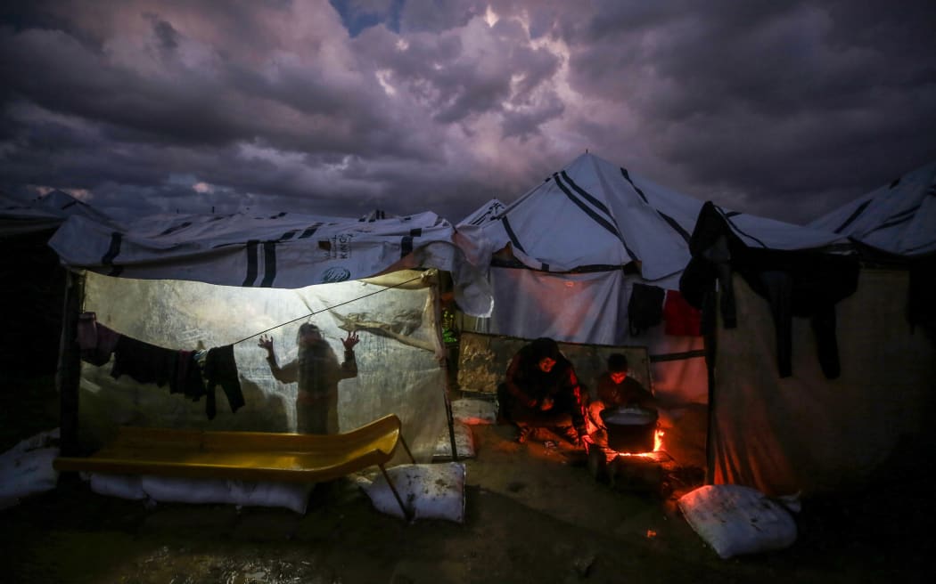 Palestinians live in makeshift tents amid harsh conditions in Nuseirat, Gaza on December 28, 2025.