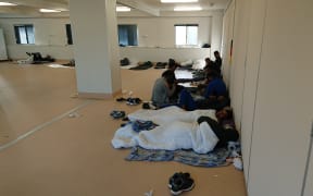 Some New Zealanders in Yongah Hill Detention Centre mess hall where they have been kept since riots.