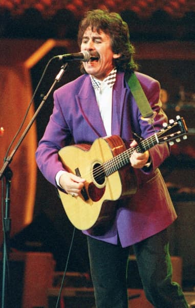 New York 1992 showing George Harrison performing "Absolutely Sweet Mary" during an all-star tribute to the music of Bob Dylan at Madison Square Garden.