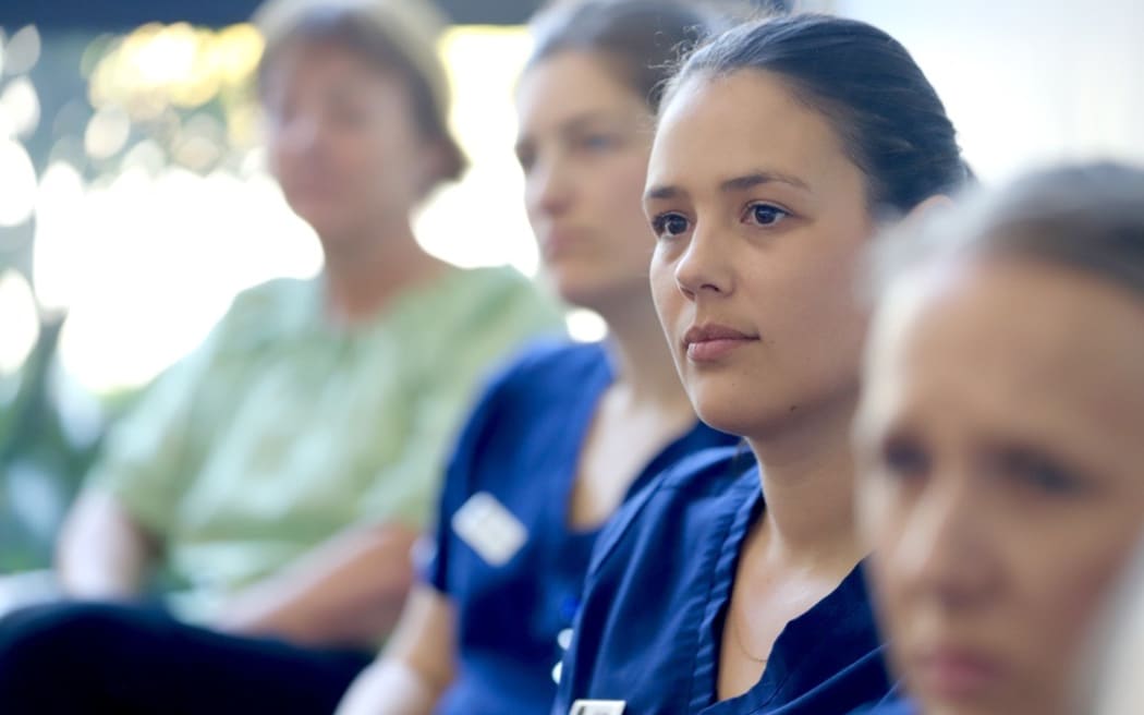 Dental nurses listening to Labour Party leader Chris Hipkins during a visit to a dental clinic in Tauranga, on the election trail.