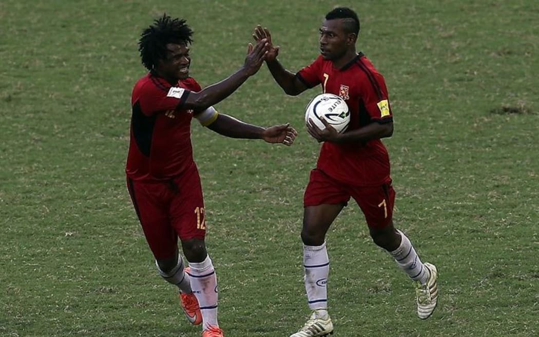 Raymond Gunemba celebrates one of his three goals against Samoa.