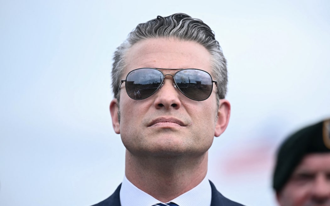 US Secretary of Defense Pete Hegseth looks on as the US president speaks at Fort Bragg, a US Army military installation, near Fayetteville, North Carolina, on June 10, 2025. (Photo by Brendan SMIALOWSKI / AFP)