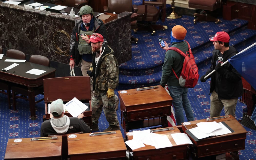 Protesters enter the Senate Chamber on January 06, 2021 in Washington, DC.