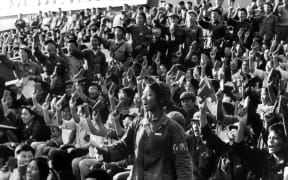 A squad of Red Guards, high school and university students, brandishing the copies of Chairman Mao Zedong's "Little Red Book," staging a rally in September 1966 in Beijing's street to spread Mao's thought during the Great Proletarian Cultural Revolution.