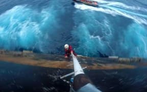 Greenpeace activist scaling Shell's oil rig Polar Pioneer in Pacific Ocean to protest against Arctic drilling.