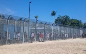 Detainees assemble for the 62nd day of protest on Manus Island.