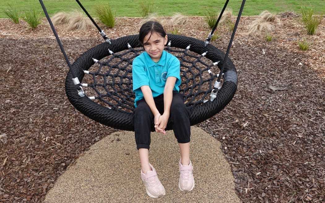Amokura tries out the basket swing.